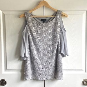 Connected Apparel Silver sequined top with sheer sleeves and cutouts